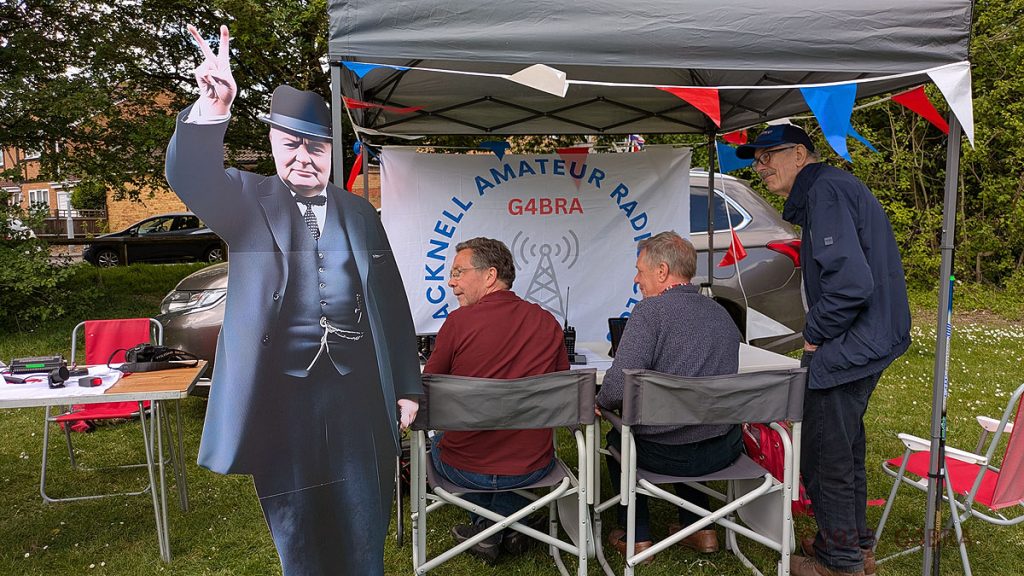 A Lifesize Cardboard Winston Churchill figure standing at the BARC Tent